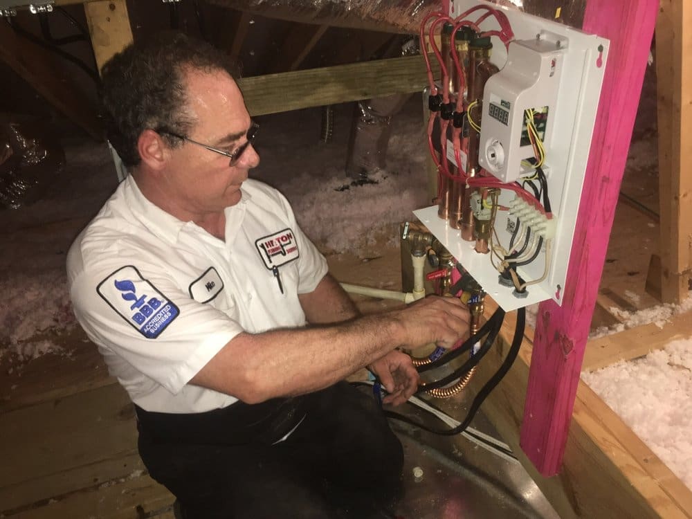 Mike Heaton, Master Plumber in Houston Texas, repairs Tankless Water Heater