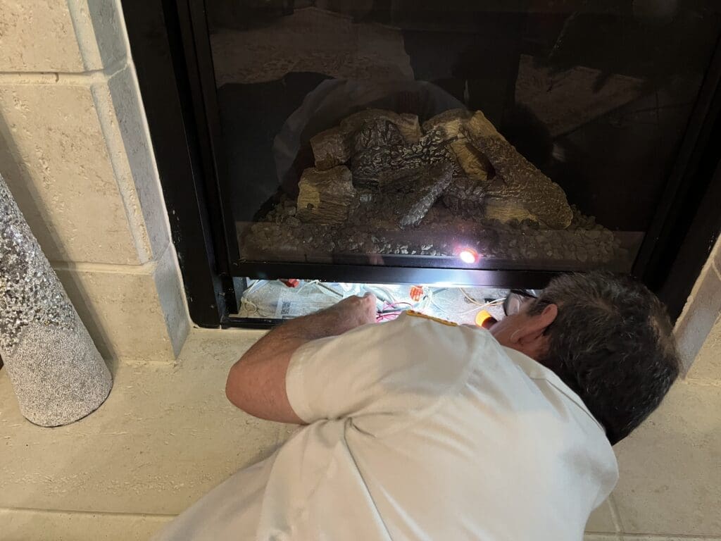 Michael Heaton, Master Plumber in Houston, Texas, completing a gas fireplace repair